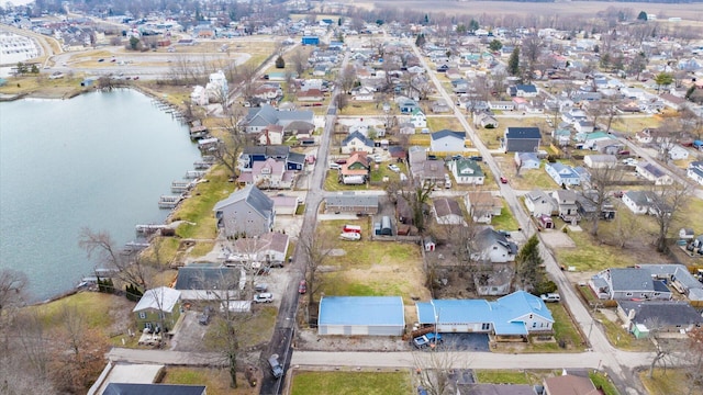 bird's eye view featuring a residential view and a water view