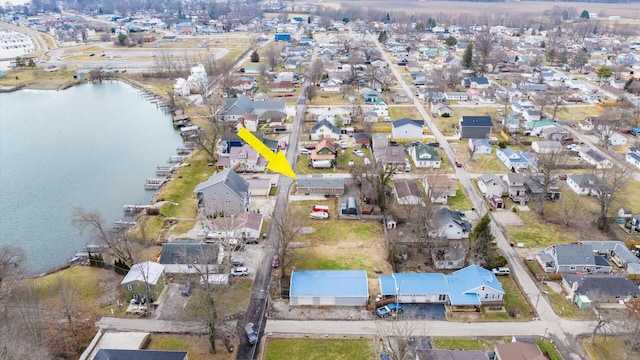 bird's eye view with a residential view and a water view