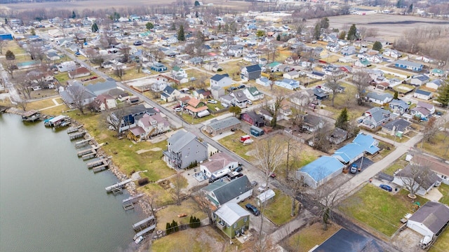 birds eye view of property featuring a residential view and a water view