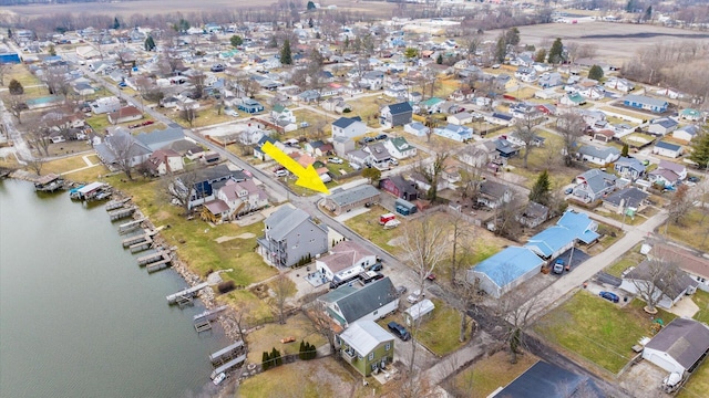 bird's eye view featuring a water view and a residential view