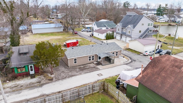 aerial view with a water view and a residential view