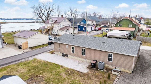 birds eye view of property with a residential view and a water view