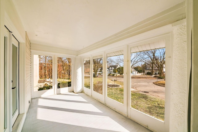 unfurnished sunroom featuring a healthy amount of sunlight