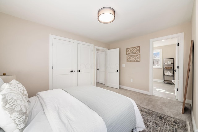 bedroom featuring baseboards and light colored carpet