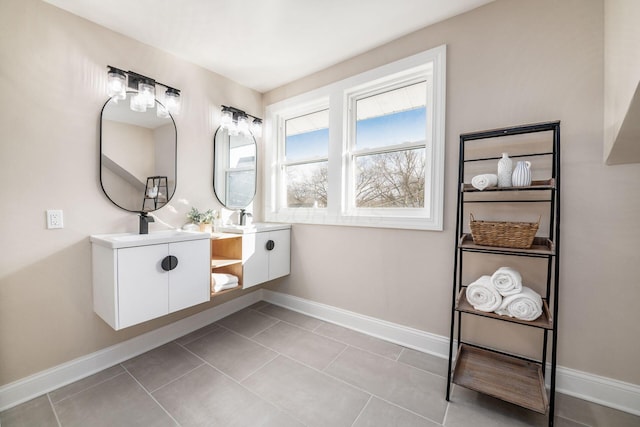 full bath featuring vanity, baseboards, and tile patterned floors