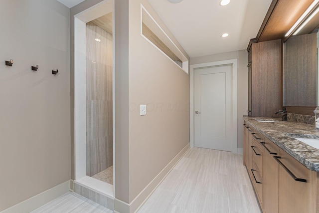 105 N Riverview St Unit 216, Dublin, OH 43017 - full bath with double vanity, baseboards, recessed lighting, and walk in shower