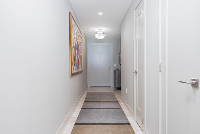 105 N Riverview St Unit 216, Dublin, OH 43017 - hallway with baseboards, a chandelier, and recessed lighting