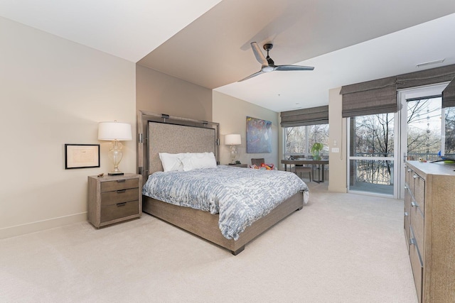 105 N Riverview St Unit 216, Dublin, OH 43017 - bedroom featuring access to outside, light carpet, baseboards, and ceiling fan