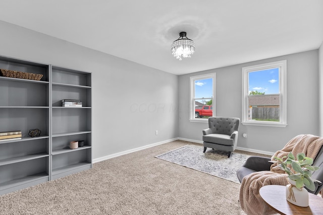 143 Walnut St, Sunbury, OH 43074 - living area with carpet floors, a chandelier, and baseboards