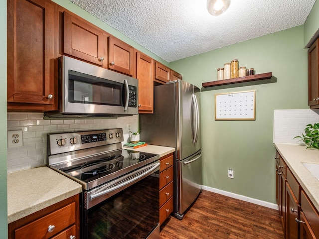 5610 Barney Ln Unit 41F, Columbus, OH 43235 - kitchen featuring appliances with stainless steel finishes, dark wood finished floors, light countertops, tasteful backsplash, and a textured ceiling