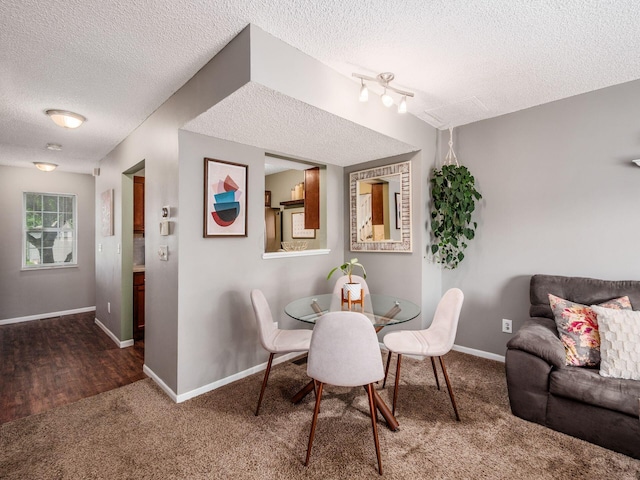 5610 Barney Ln Unit 41F, Columbus, OH 43235 - dining space with a textured ceiling, carpet floors, and baseboards