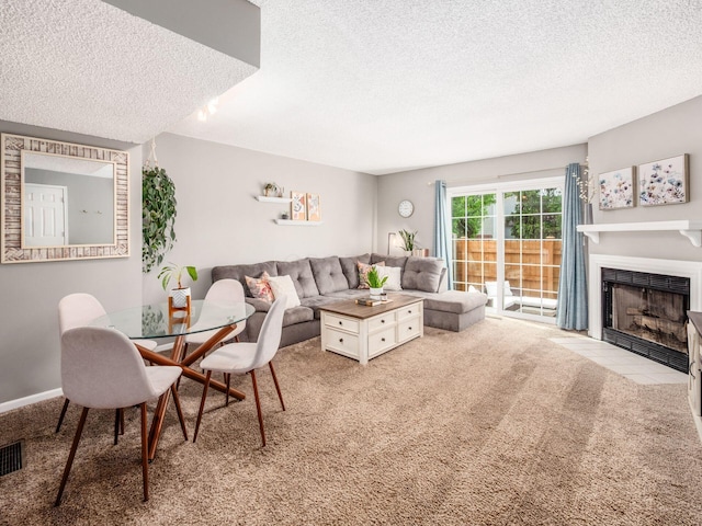5610 Barney Ln Unit 41F, Columbus, OH 43235 - carpeted living room featuring a textured ceiling, a fireplace with flush hearth, and baseboards