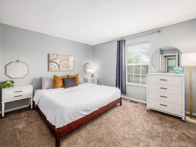 5610 Barney Ln Unit 41F, Columbus, OH 43235 - bedroom with carpet floors, a textured ceiling, and baseboards