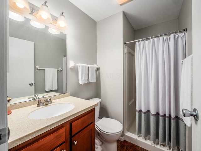 5610 Barney Ln Unit 41F, Columbus, OH 43235 - full bath with a stall shower, toilet, vanity, and wood finished floors