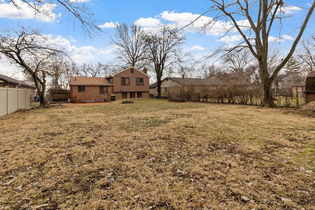 view of yard featuring cooling unit and a fenced backyard