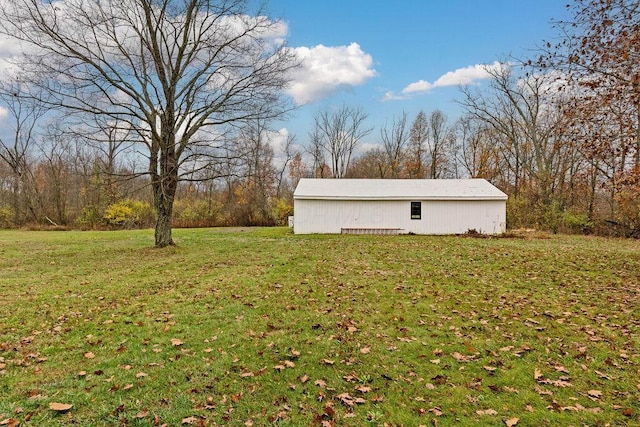 view of yard featuring an outbuilding and a pole building