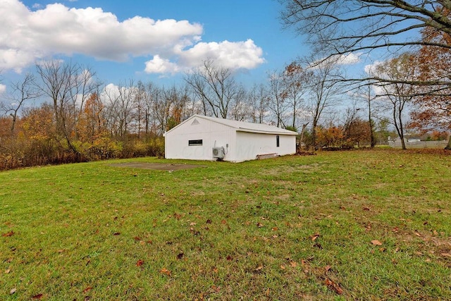 view of yard featuring an outbuilding and an outdoor structure