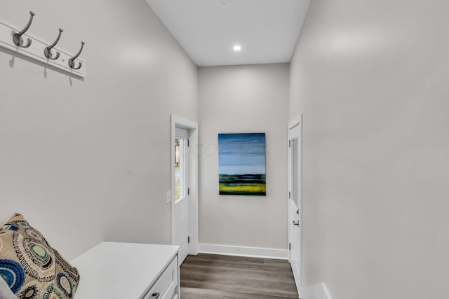 doorway to outside featuring recessed lighting, dark wood-style flooring, and baseboards