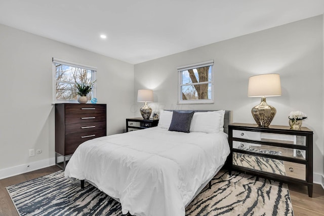 bedroom featuring recessed lighting, baseboards, and wood finished floors