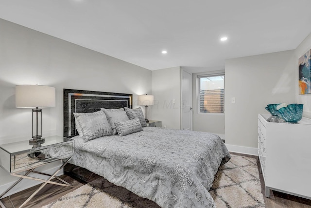 bedroom featuring recessed lighting, baseboards, and wood finished floors