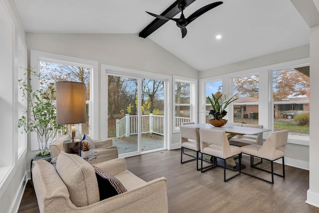 sunroom with lofted ceiling with beams and a ceiling fan