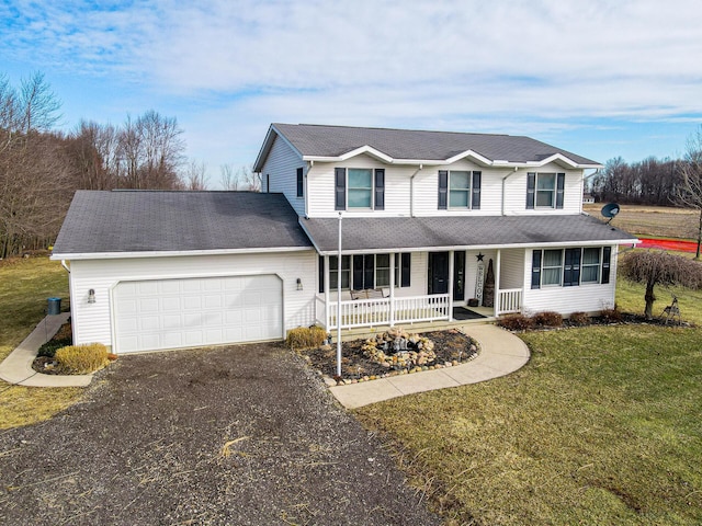 traditional home with a porch, aphalt driveway, an attached garage, roof with shingles, and a front yard