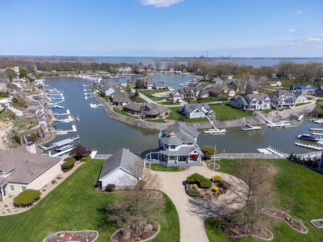 aerial view with a residential view and a water view