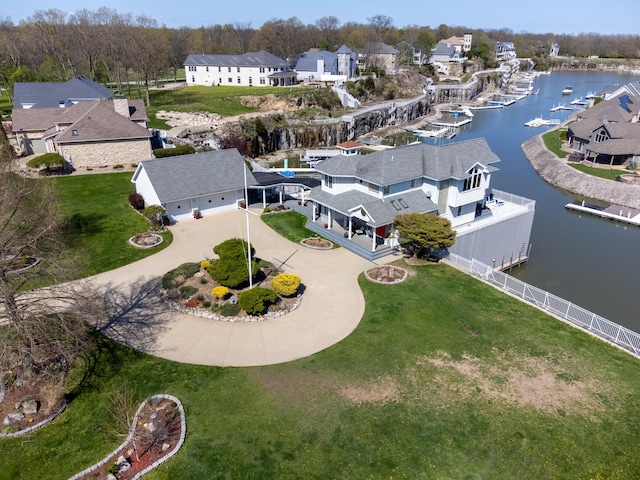 aerial view with a residential view and a water view