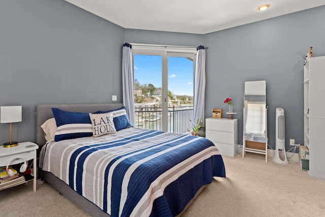 carpeted bedroom featuring access to exterior