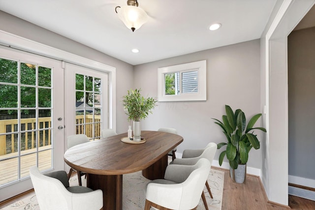 dining area with light wood-style floors, recessed lighting, baseboards, and french doors