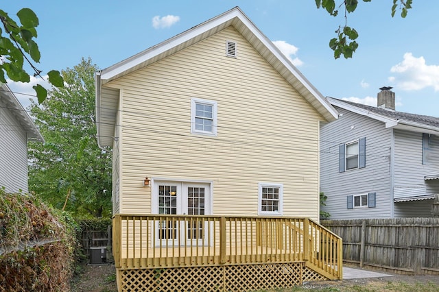 back of house with fence, central AC, and a wooden deck