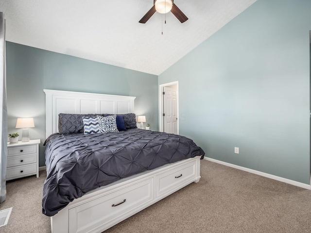 bedroom with baseboards, light colored carpet, ceiling fan, and vaulted ceiling