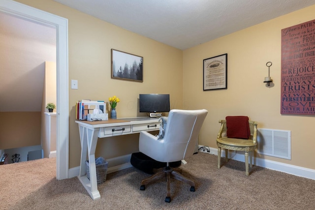 office area featuring carpet floors, visible vents, and baseboards