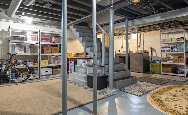 unfinished below grade area featuring washer / clothes dryer and stairway