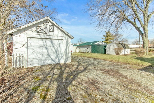 view of outbuilding featuring an outbuilding and dirt driveway