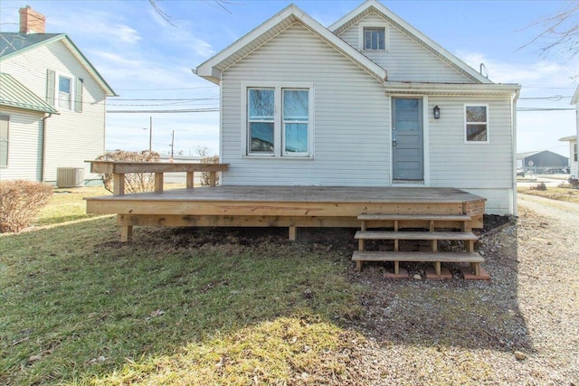 back of house with a deck, a yard, and central AC unit