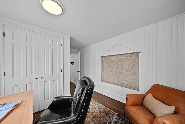 office area with dark wood-style floors and baseboards