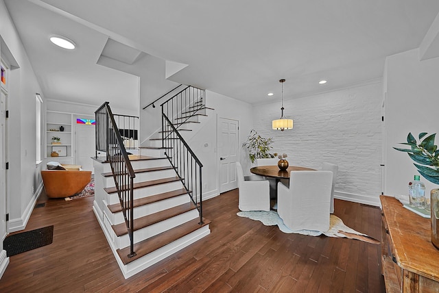 interior space with stairway, recessed lighting, hardwood / wood-style flooring, and baseboards