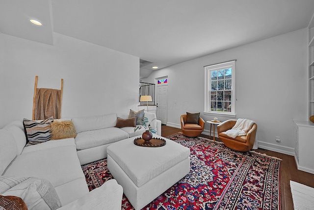 living room with baseboards, wood finished floors, and recessed lighting