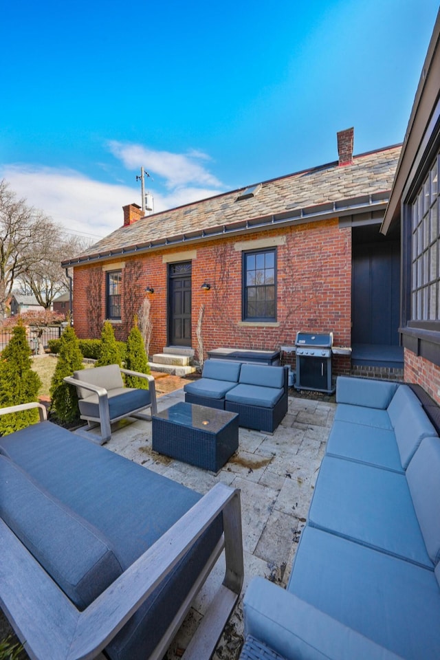 view of patio with grilling area and an outdoor hangout area