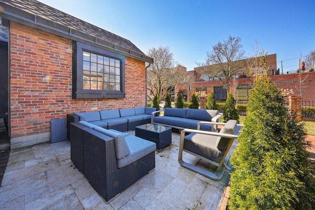 view of patio / terrace with outdoor lounge area and fence