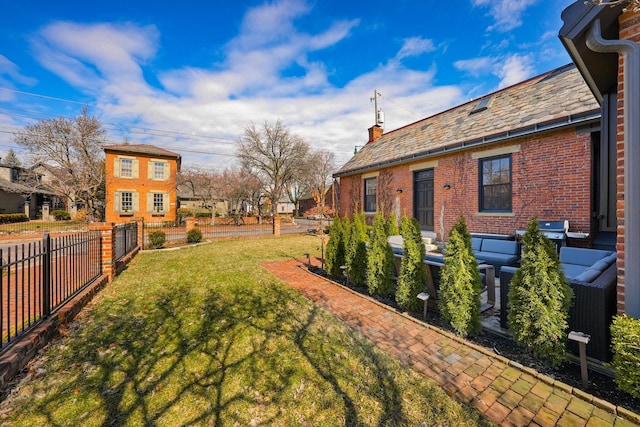 view of yard with an outdoor hangout area and fence