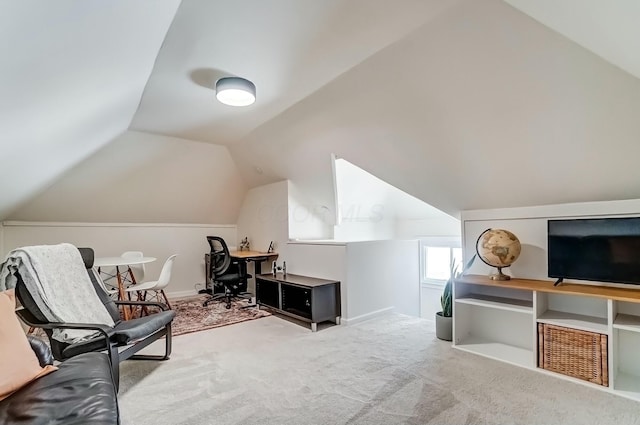 interior space featuring carpet floors and lofted ceiling