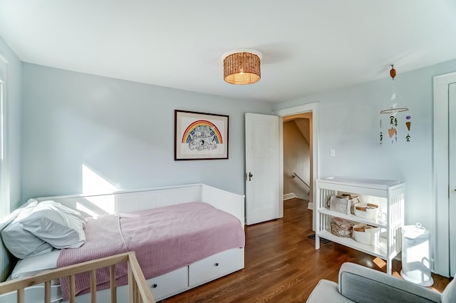 bedroom with wood finished floors