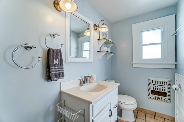 bathroom featuring vanity, toilet, and tile patterned floors