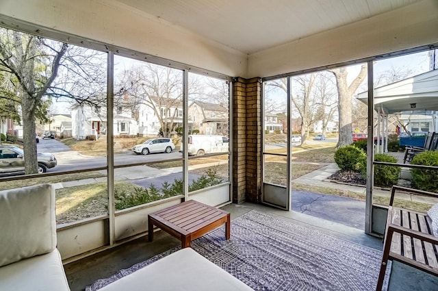 sunroom / solarium with a residential view