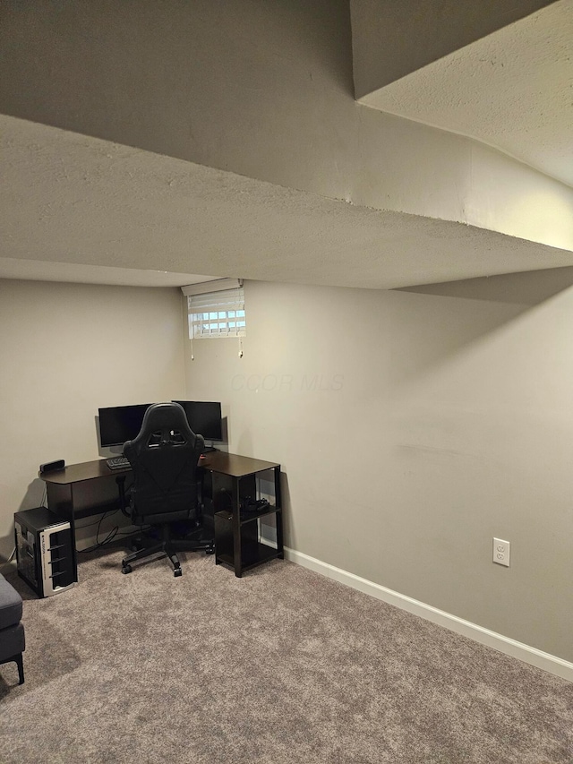 office with carpet flooring, a textured ceiling, and baseboards