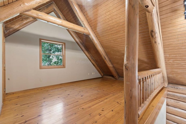 bonus room featuring wooden ceiling, lofted ceiling with beams, and hardwood / wood-style flooring