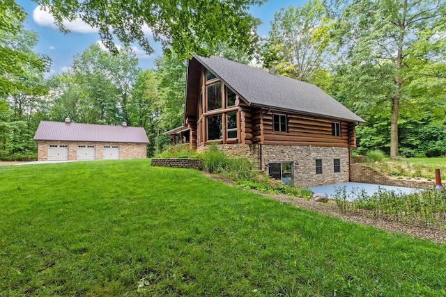 view of home's exterior featuring a detached garage, a shingled roof, a lawn, log exterior, and stone siding