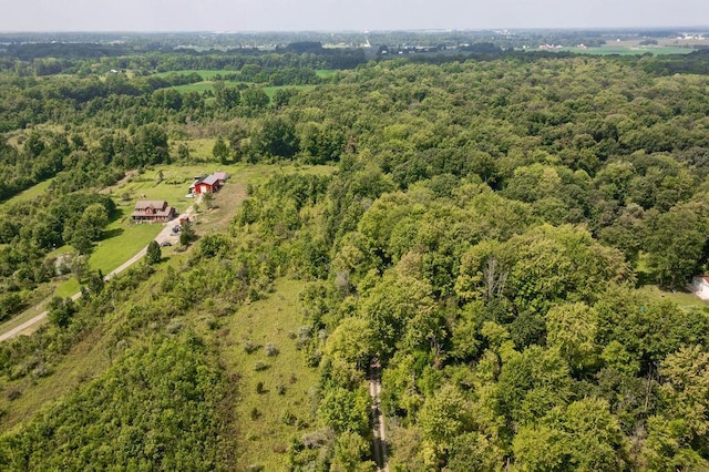 bird's eye view featuring a wooded view